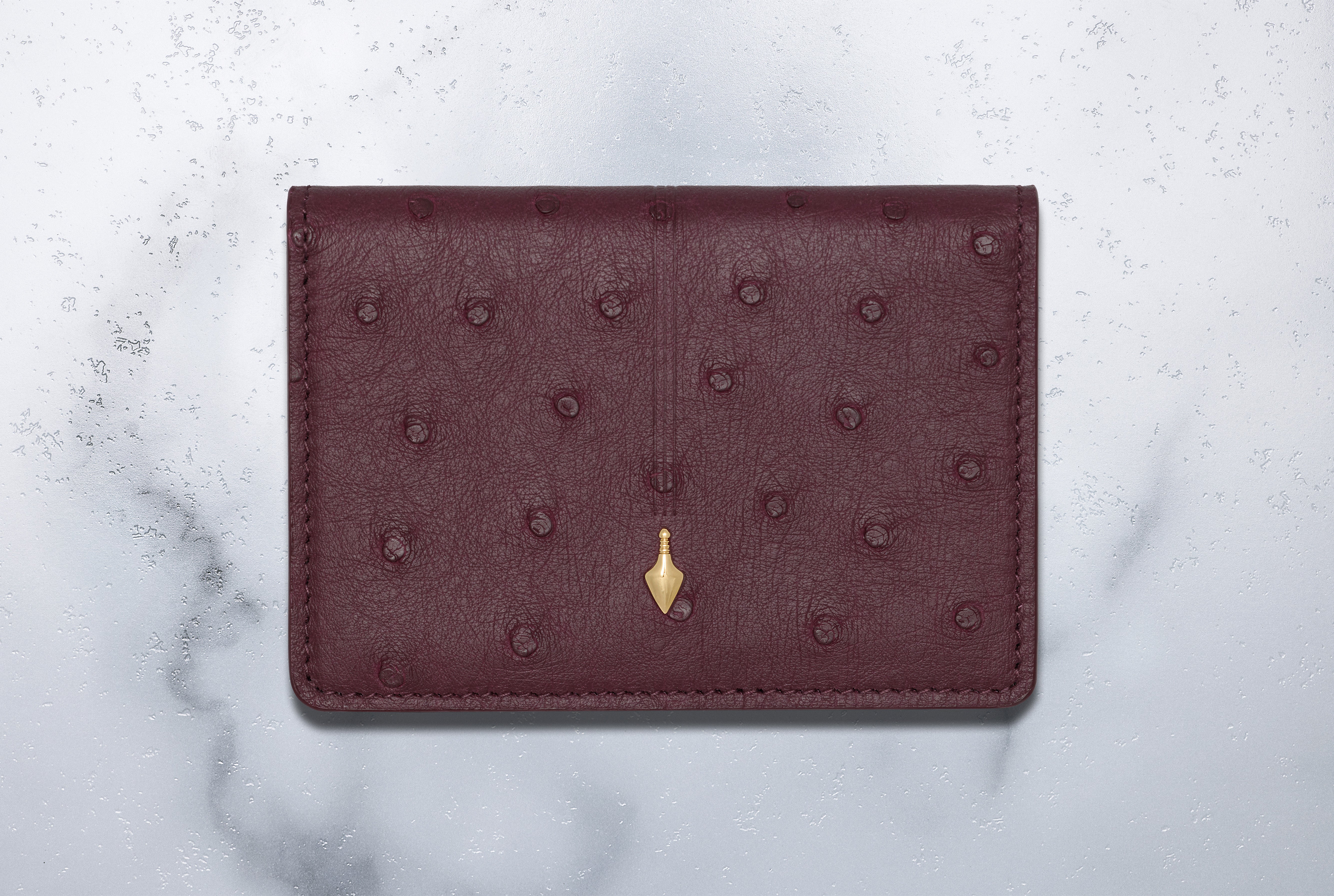 Jacques Marie Mage Cassandre portafoglio bifold Bordeaux Ostrich