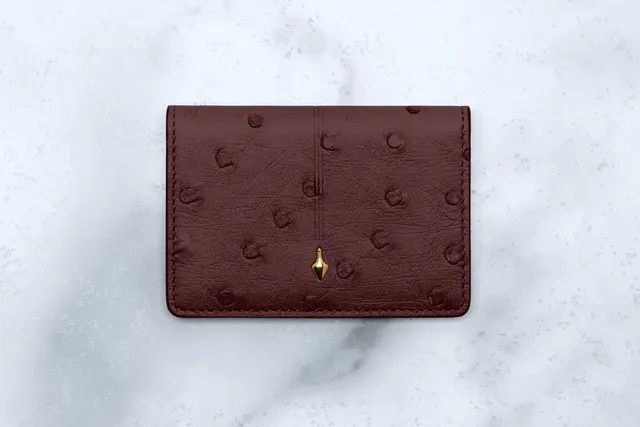 Jacques Marie Mage Cassandre portafoglio bifold Bordeaux Ostrich