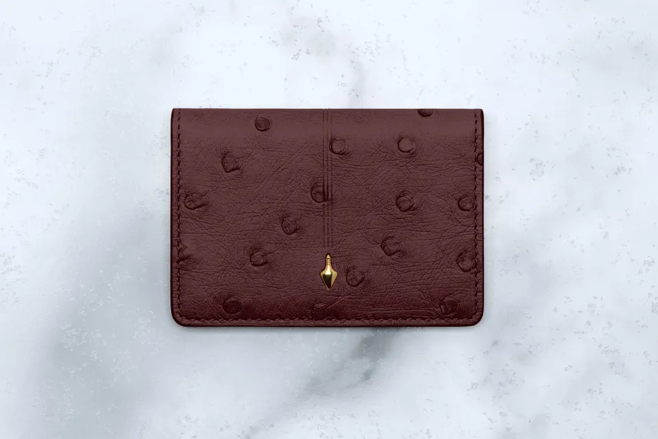 Jacques Marie Mage Cassandre portafoglio bifold Bordeaux Ostrich