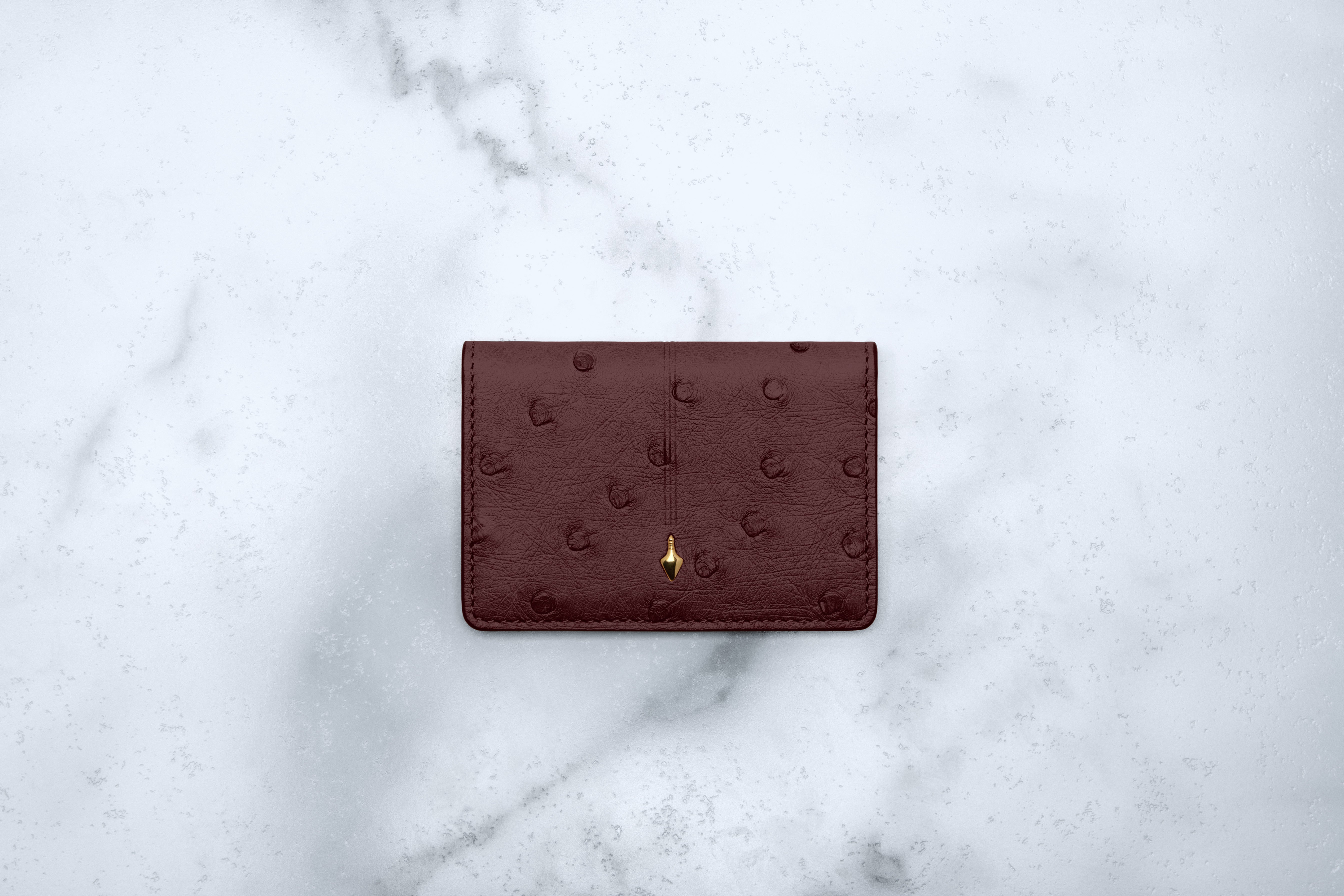 Jacques Marie Mage Cassandre portafoglio bifold Bordeaux Ostrich