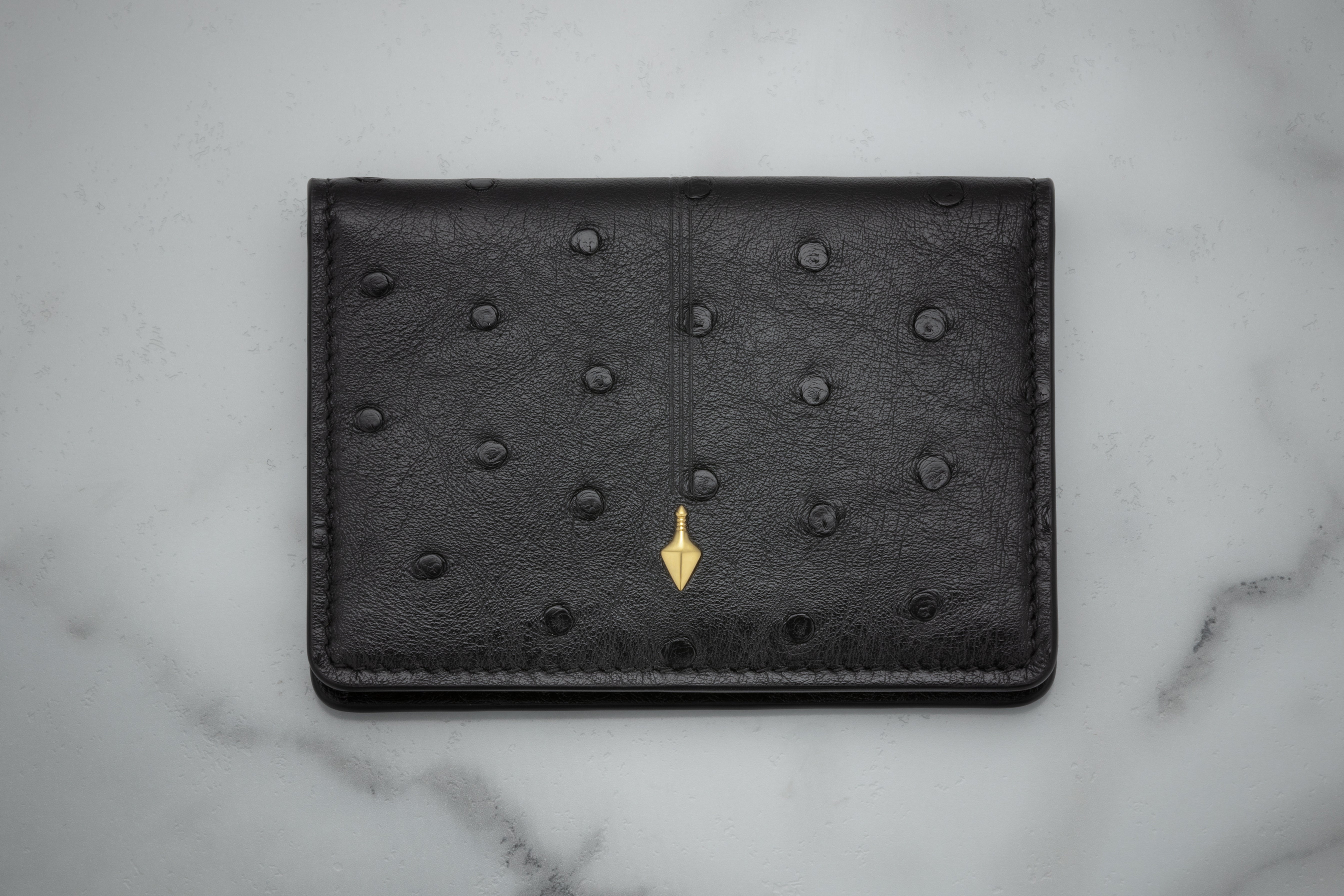 Jacques Marie Mage Cassandre portafoglio bifold Bordeaux Ostrich