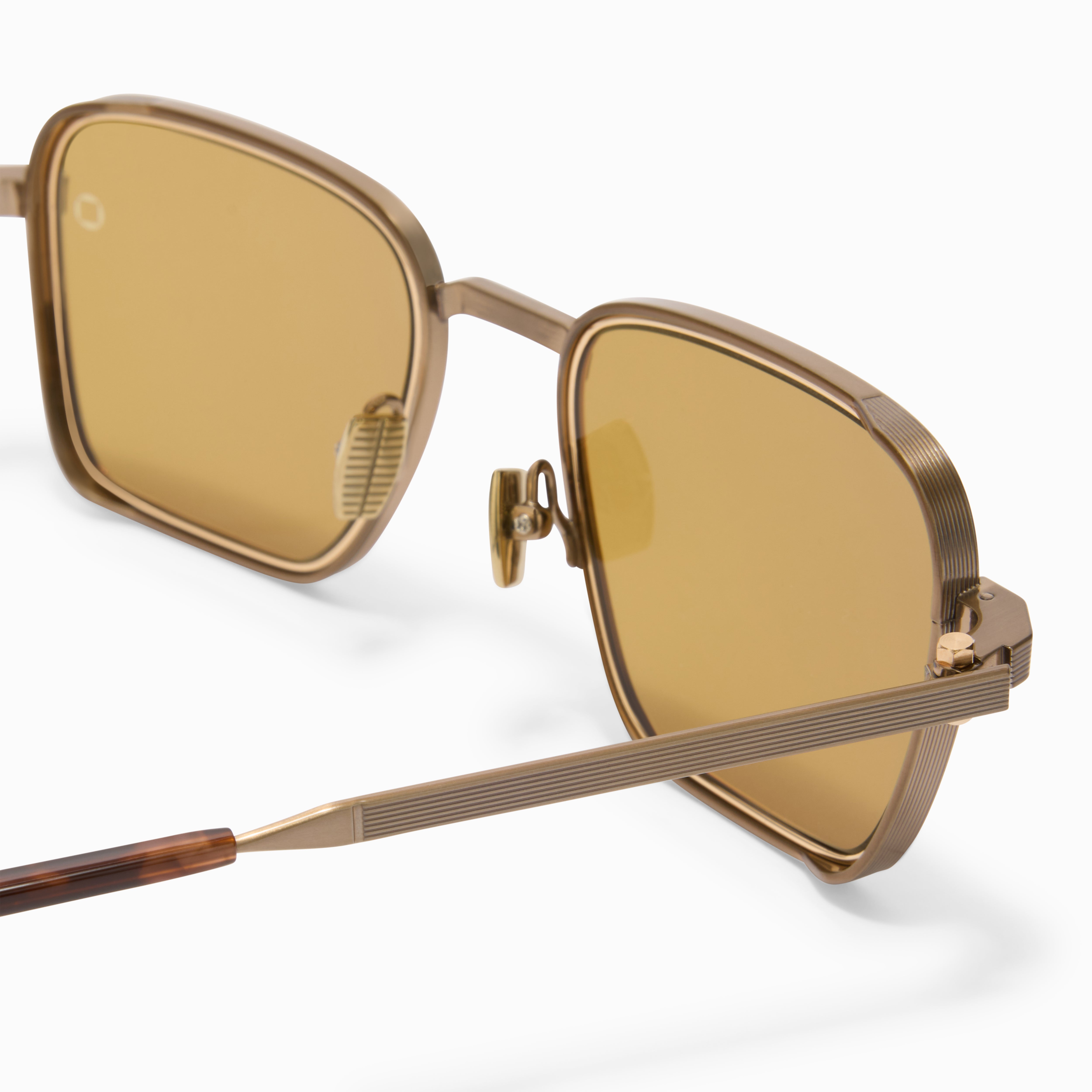 Akoni Etere Giano-Two occhiali da sole Antique 12k Gold titanio